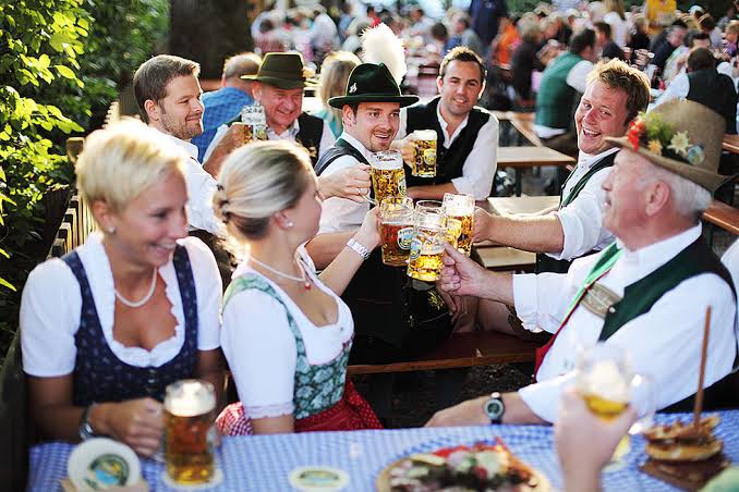 Raising glasses of Bavarian beer together