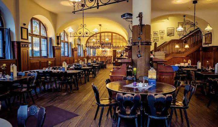 Traditional Munich Wirtshaus interior with wooden furniture and vaulted ceilings