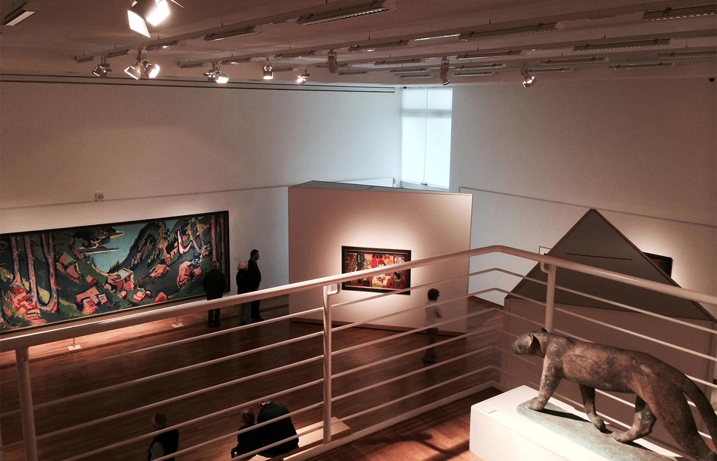 An exhibition room at the Buchheim Museum with Expressionist art and visitors