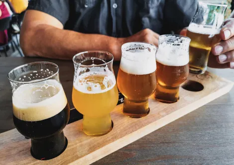 A guided tasting flight of different beer styles, from dark to pale
