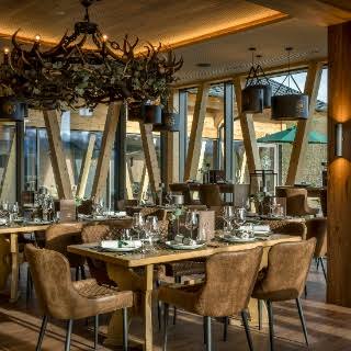 Warm restaurant interior set for dinner