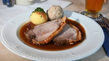 Bavarian roast with dumplings and a glass of beer