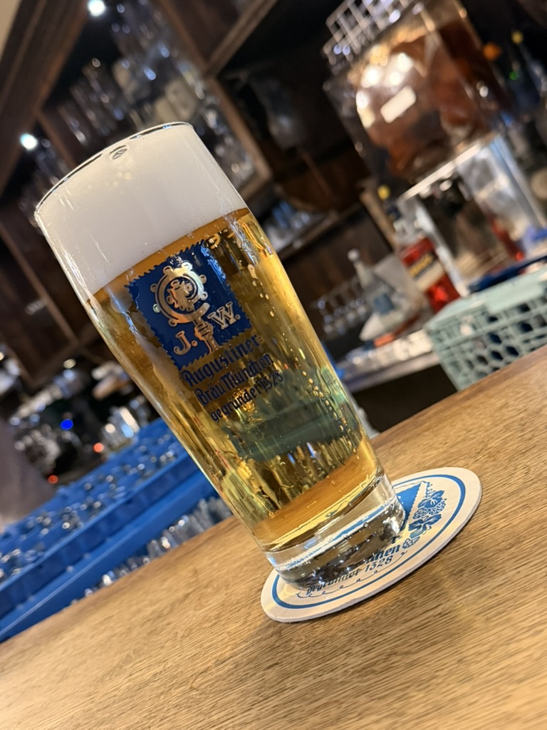 Freshly tapped Augustiner beer on a wooden counter